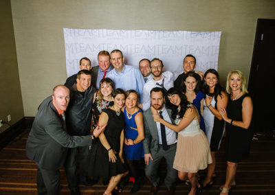 A Large Group Photo Booth Photo at a OneSource Strategy Event