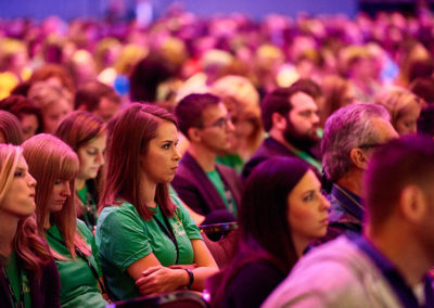 Close Shot of a Crowd of People Listening to a Presentation at a OneSource Strategy Event